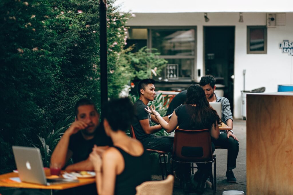 People In A Cafe Discussing Ideas